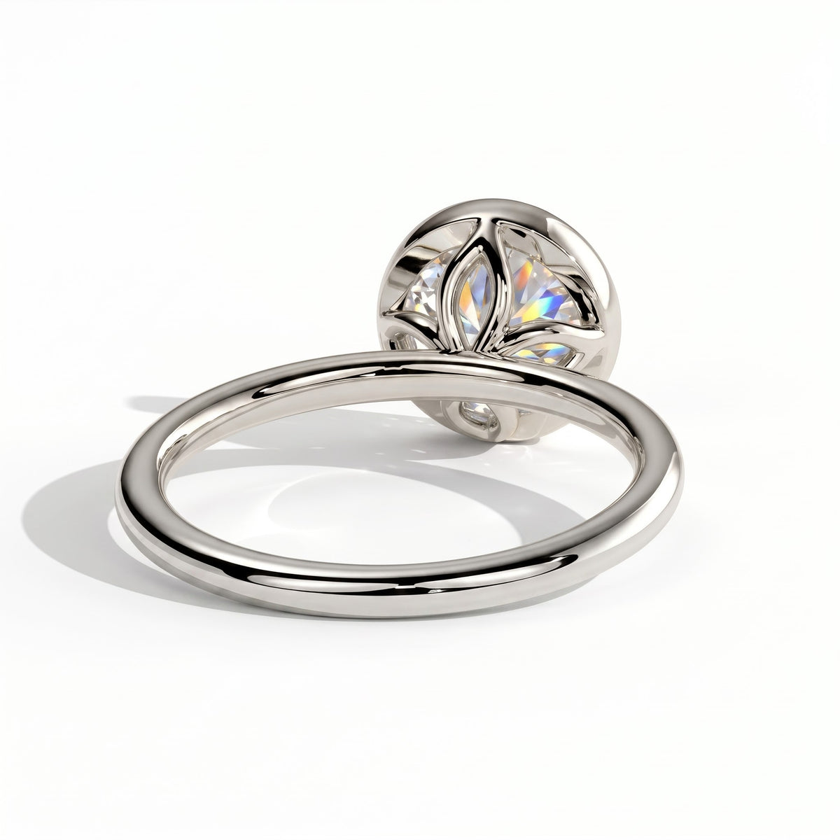 Round lab-grown diamond bezel-set solitaire engagement ring in 14K (585) white gold, on white background 