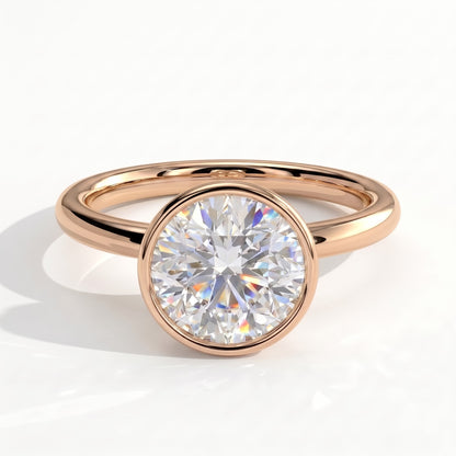 Round lab-grown diamond bezel-set solitaire engagement ring in 14K (585) rose gold, front view 