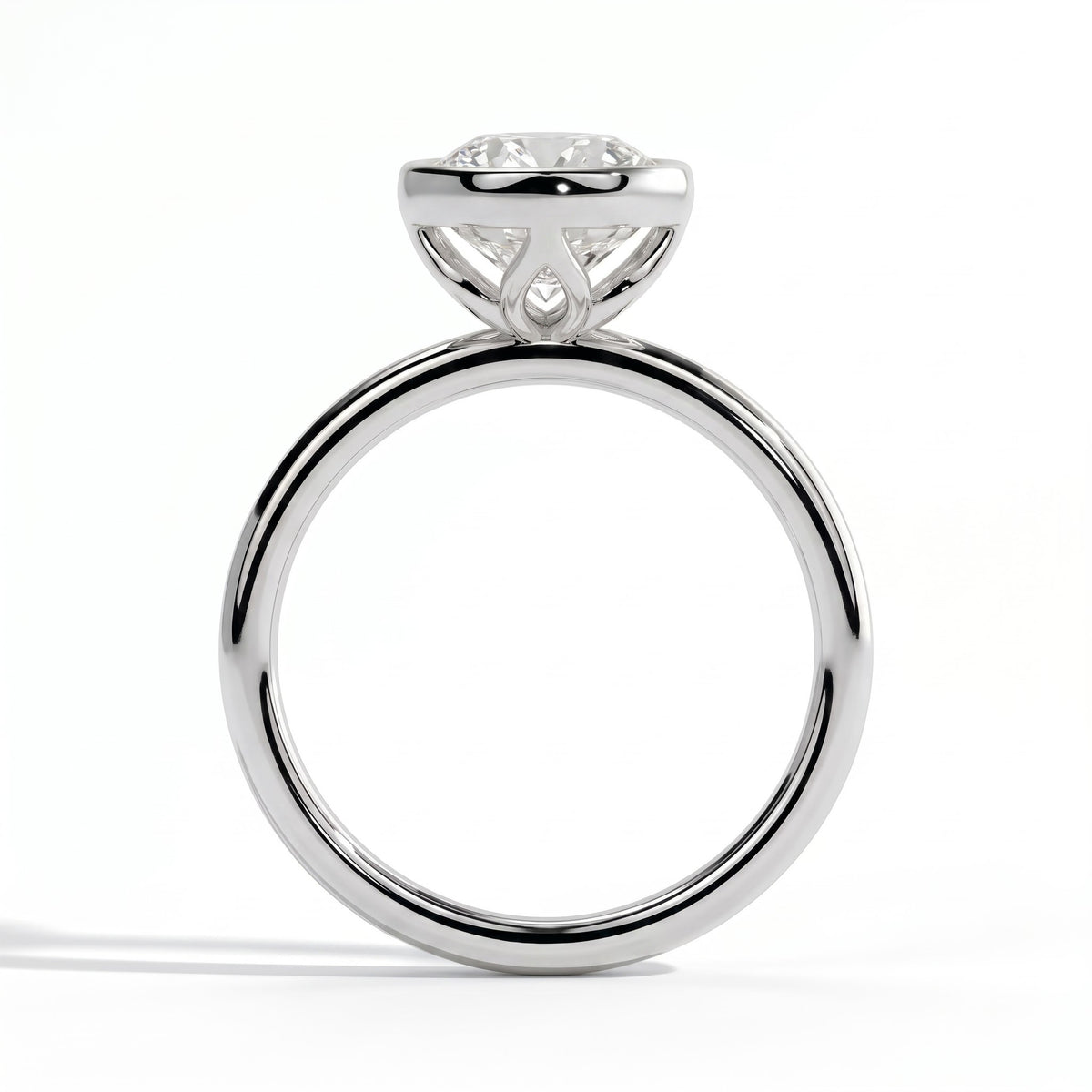 Round lab-grown diamond bezel-set solitaire engagement ring in 14K (585) white gold, side profile 