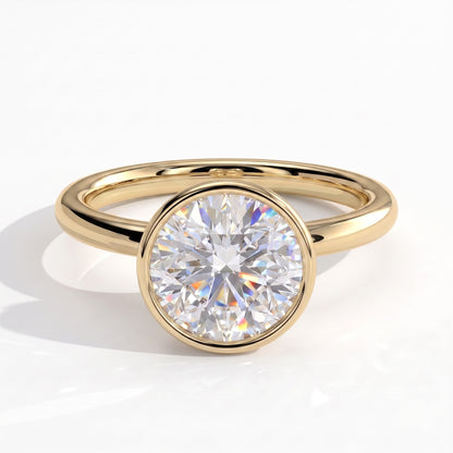 Round lab-grown diamond bezel-set solitaire engagement ring in 14K (585) yellow gold, front view 