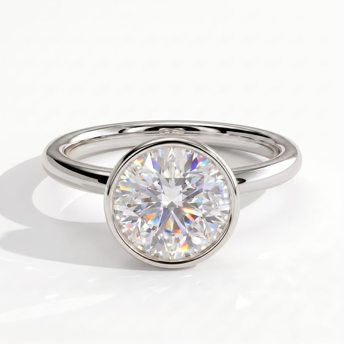 Round lab-grown diamond bezel-set solitaire engagement ring in 14K (585) white gold, front view 