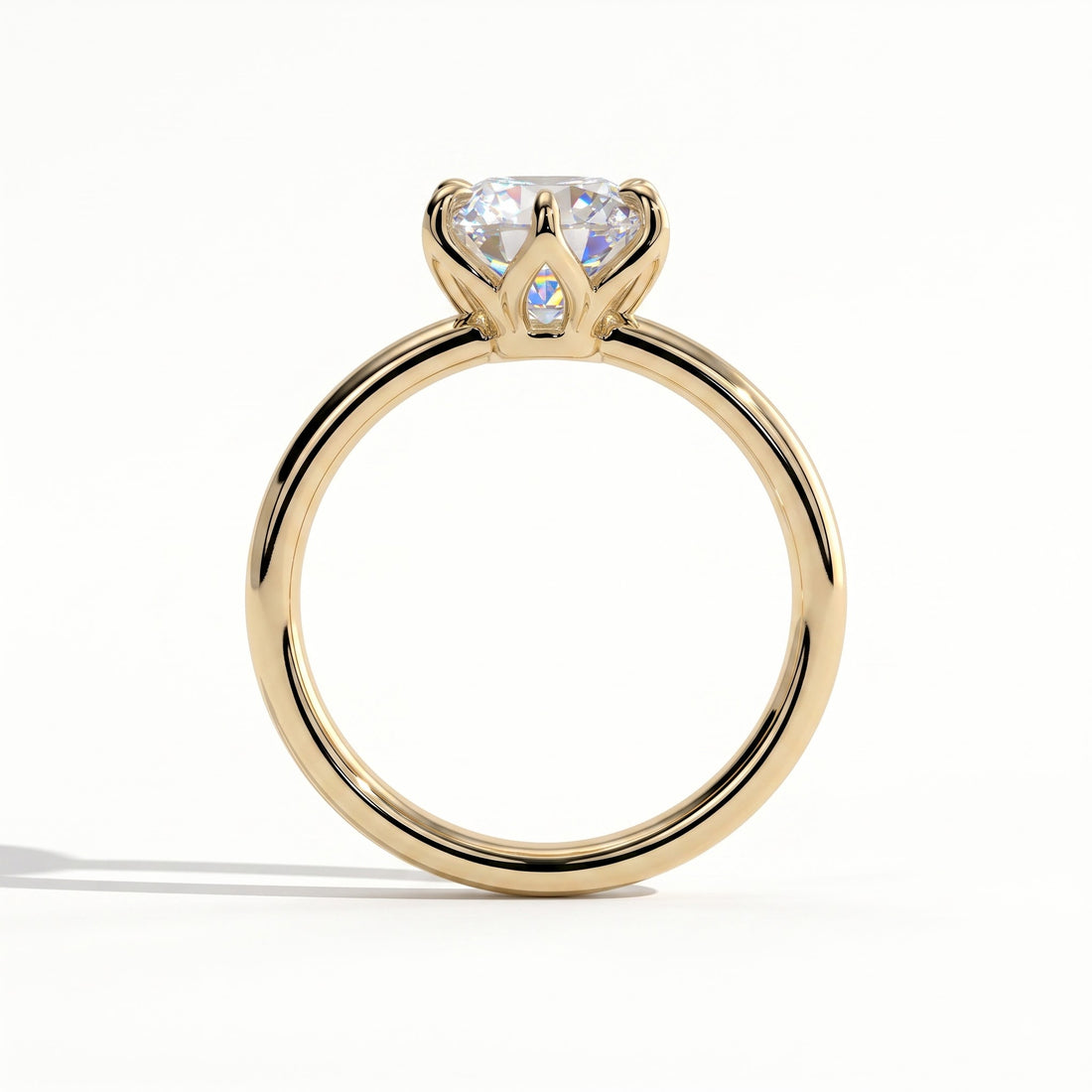 Round lab-grown diamond solitaire engagement ring in 14K (585) yellow gold, side profile 