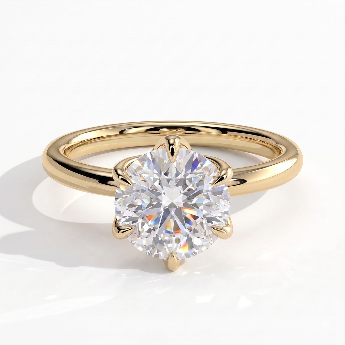 Round lab-grown diamond solitaire engagement ring in 14K (585) yellow gold, front view 