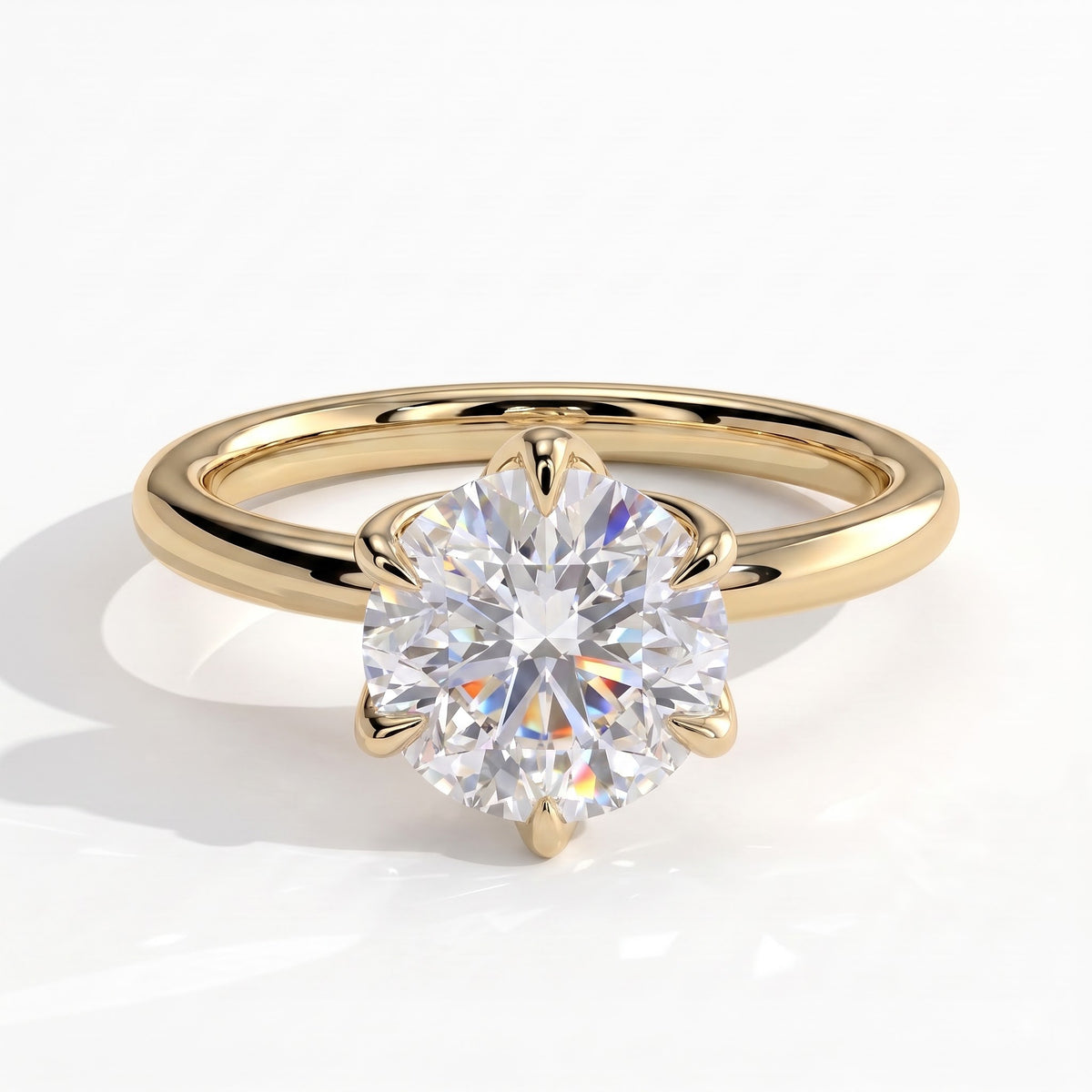 Round lab-grown diamond solitaire engagement ring in 14K (585) yellow gold, front view 