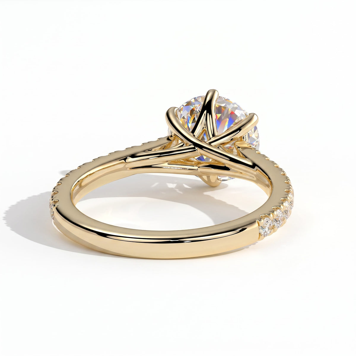 Round lab-grown diamond halo engagement ring in 14K (585) yellow gold, on white background 