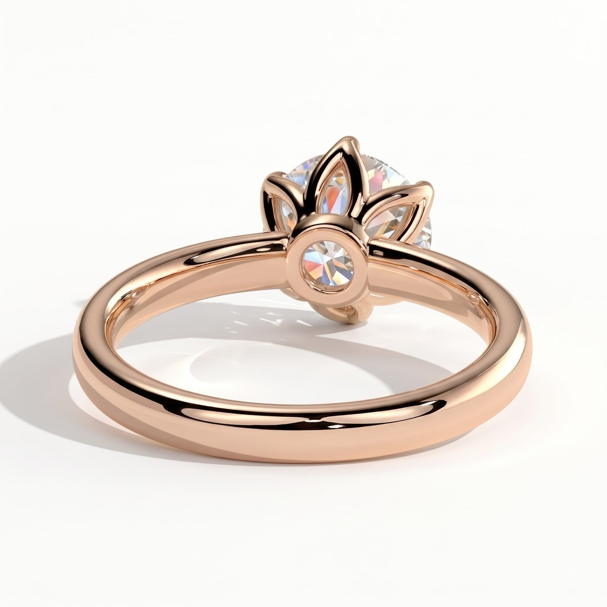 Round lab-grown diamond solitaire engagement ring in 18K (750) rose gold, on white background 