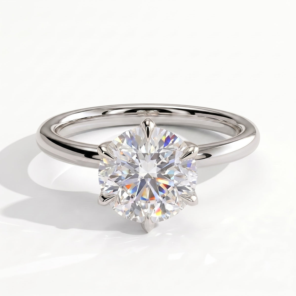 Round lab-grown diamond solitaire engagement ring in 18K (750) white gold, front view 