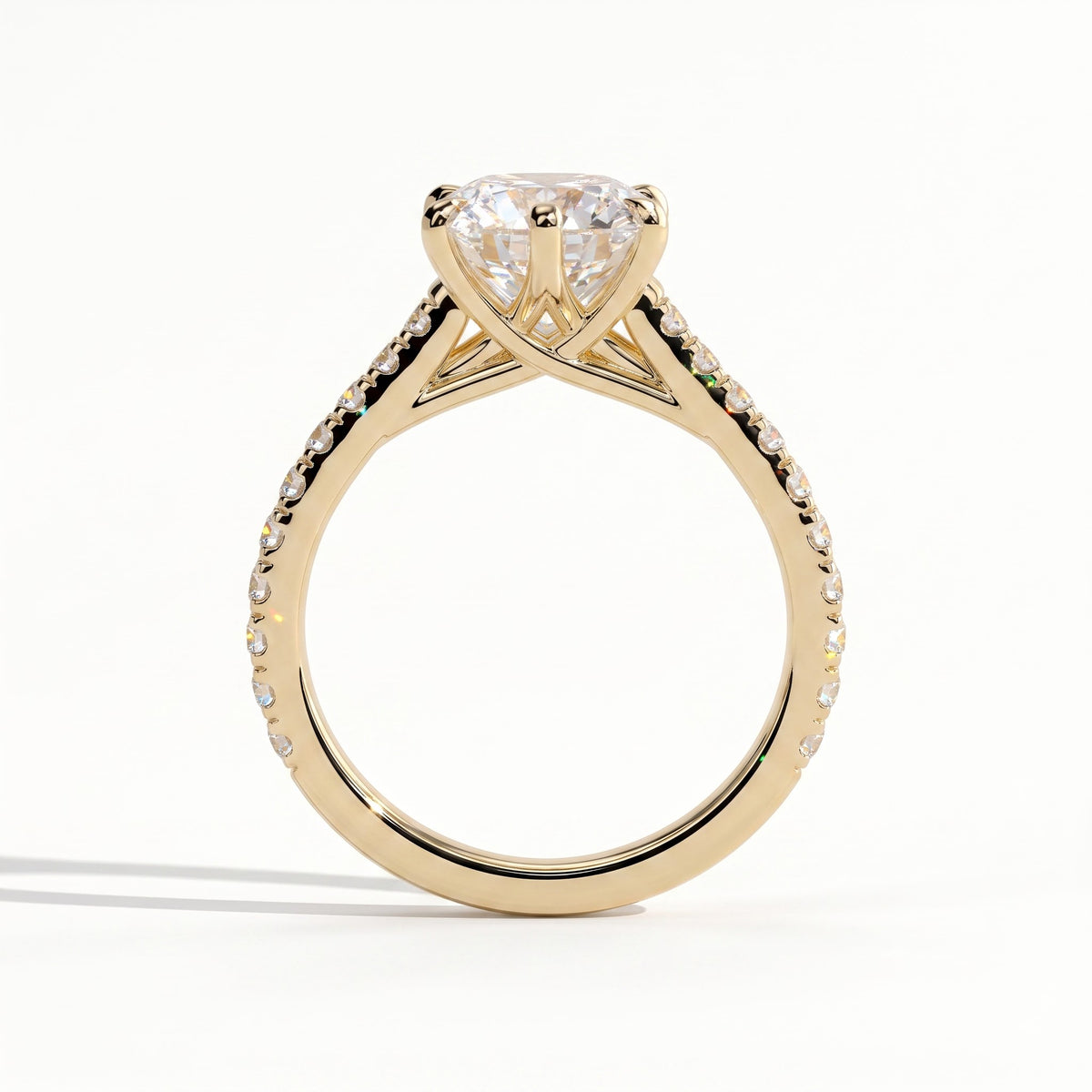 Round lab-grown diamond halo engagement ring in 18K (750) yellow gold, side profile 