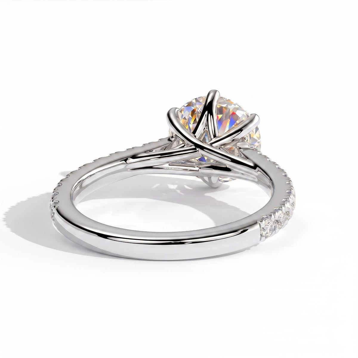 Round lab-grown diamond halo engagement ring in 950 platinum, on white background 