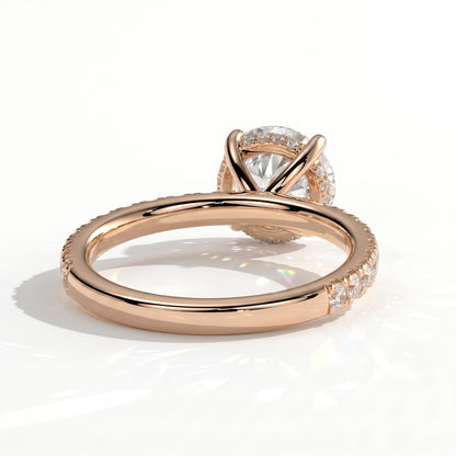 Round lab-grown diamond halo engagement ring in 18K (750) rose gold, on white background 