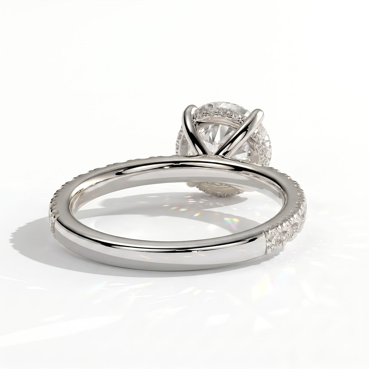 Round lab-grown diamond halo engagement ring in 18K (750) white gold, on white background 