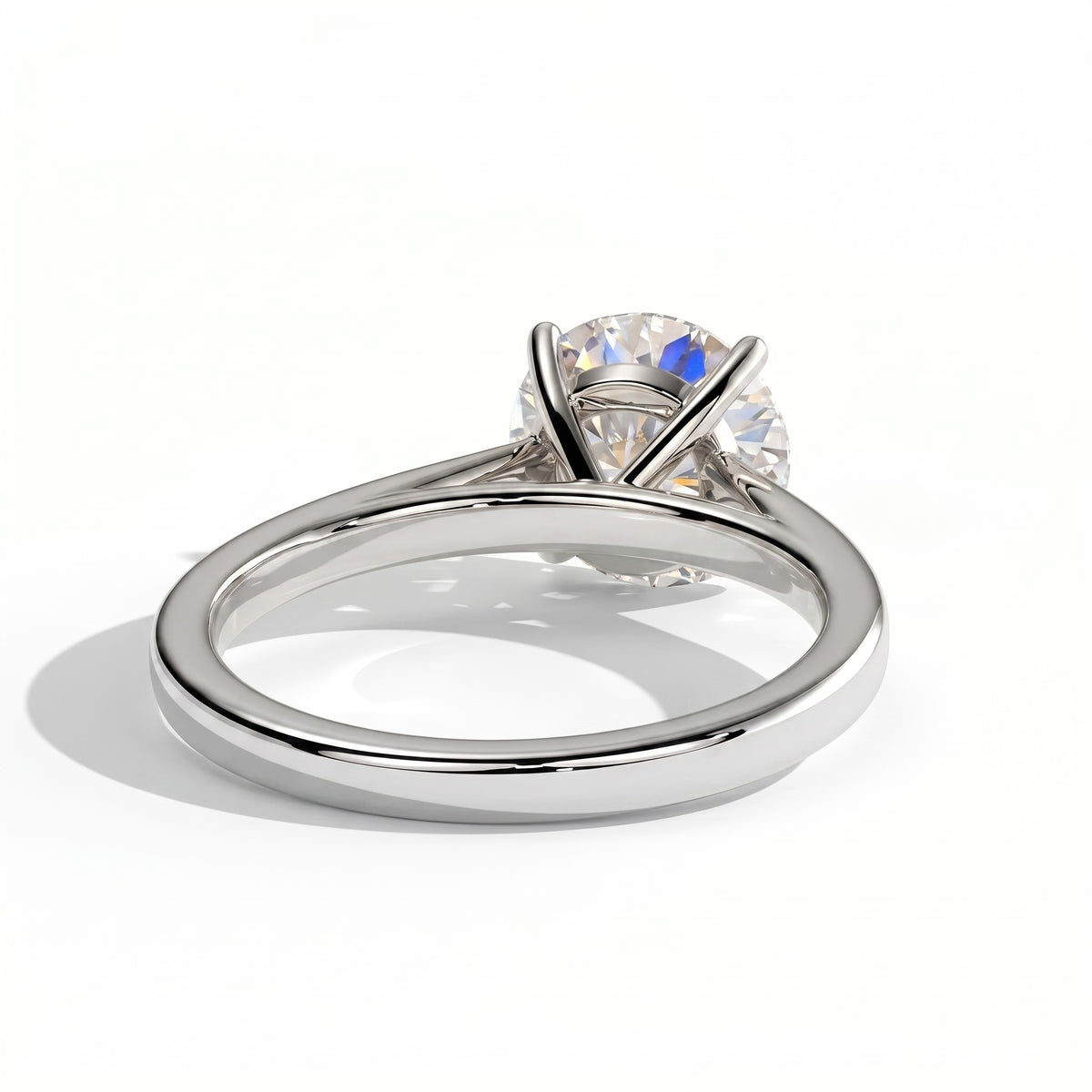 Round lab-grown diamond halo engagement ring in 18K (750) white gold, on white background 