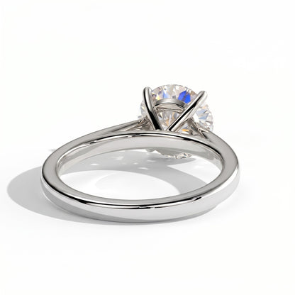 Round lab-grown diamond halo engagement ring in 18K (750) white gold, on white background 