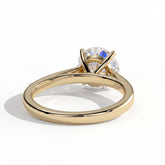 Round lab-grown diamond halo engagement ring in 18K (750) yellow gold, on white background 