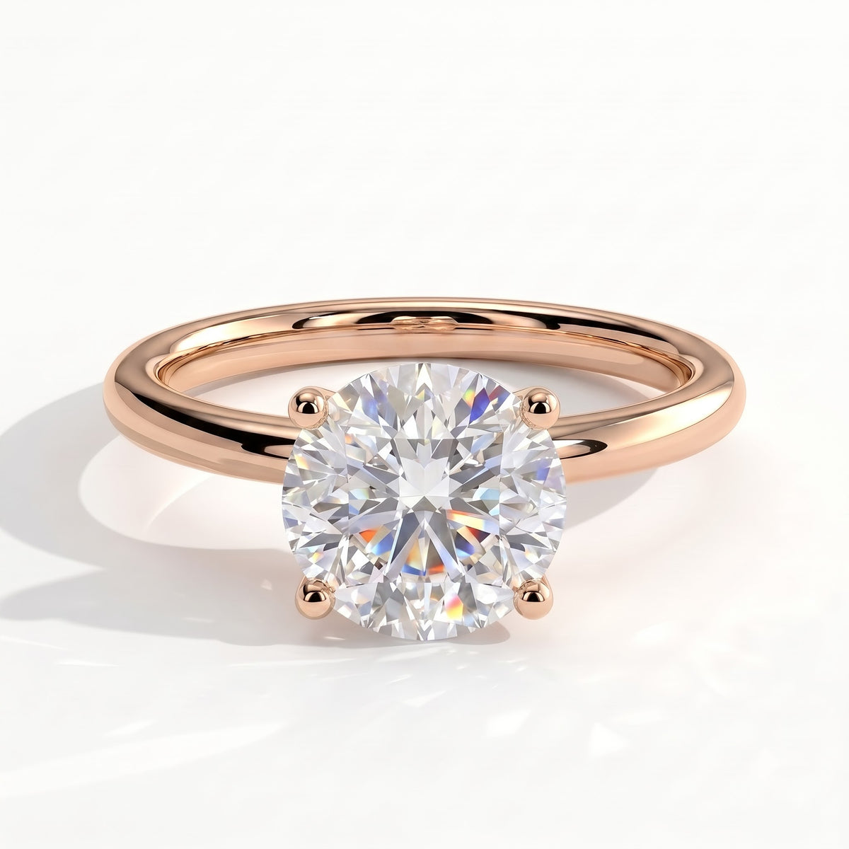 Round lab-grown diamond halo engagement ring in 18K (750) rose gold, front view 