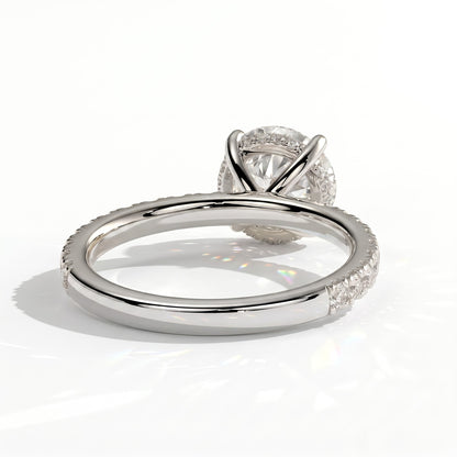Round lab-grown diamond halo engagement ring in 950 platinum, on white background 
