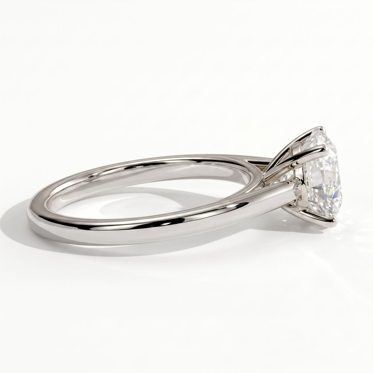 Round lab-grown diamond halo engagement ring in 950 platinum, on white background 