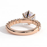 Round lab-grown diamond halo engagement ring in 18K (750) rose gold, on white background 