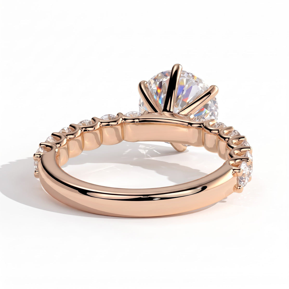 Round lab-grown diamond halo engagement ring in 18K (750) rose gold, on white background 