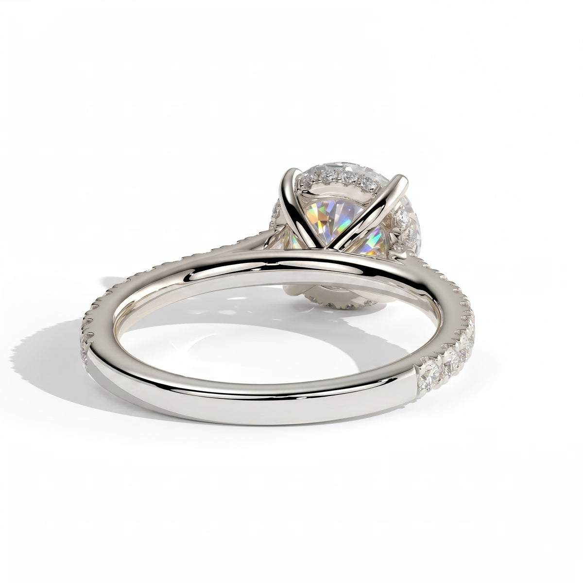 Round lab-grown diamond halo engagement ring in 18K (750) white gold, on white background 