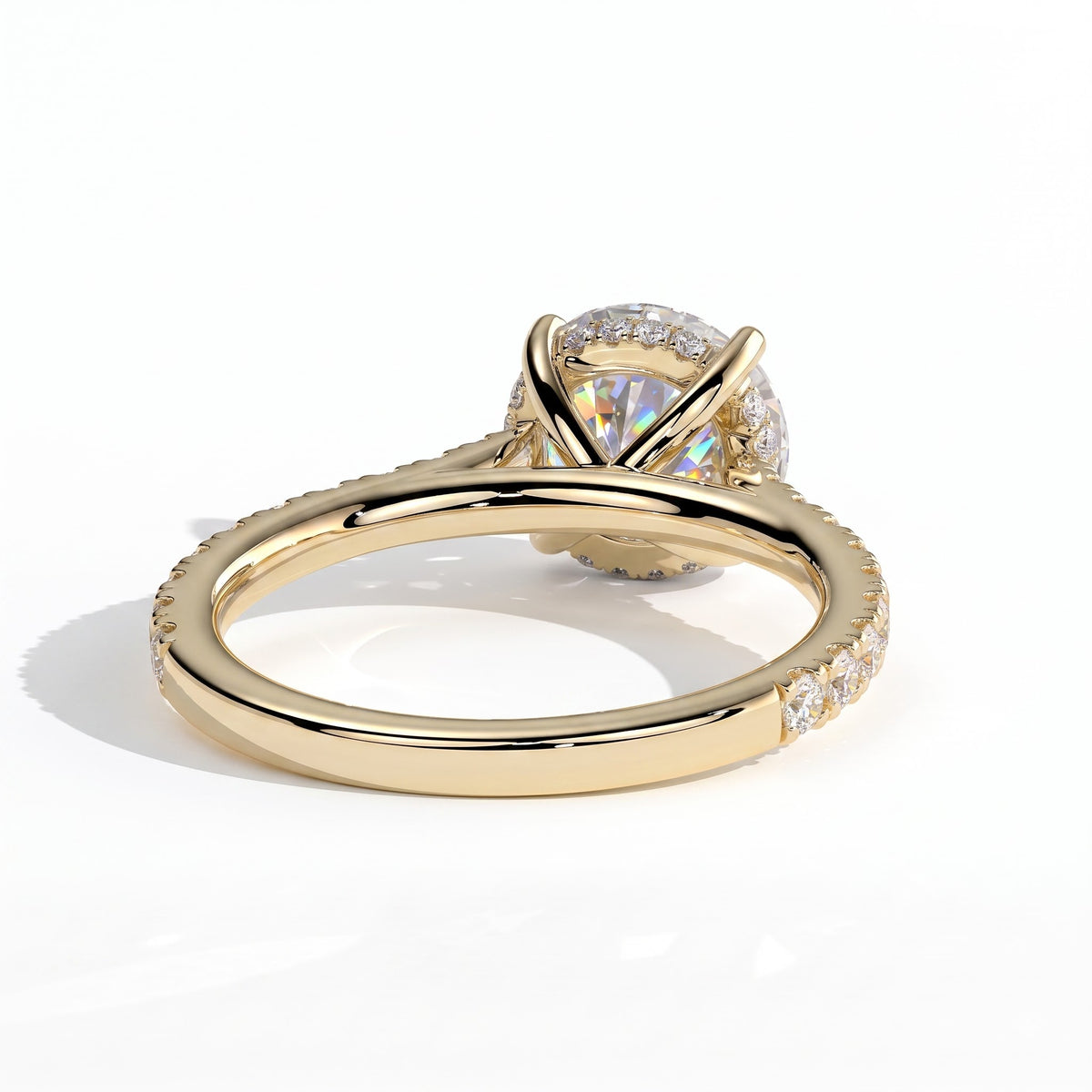 Round lab-grown diamond halo engagement ring in 18K (750) yellow gold, on white background 