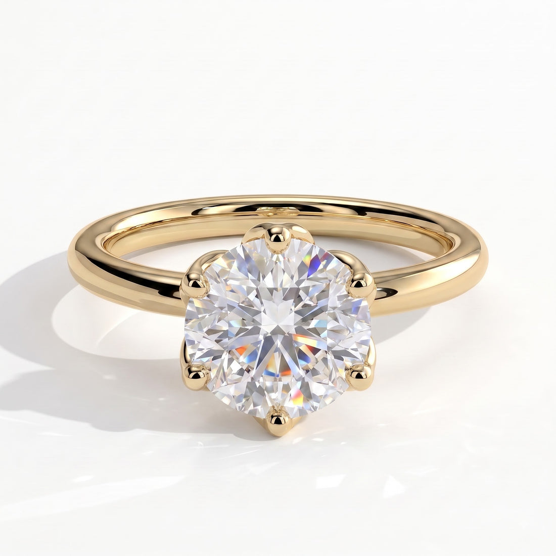 Round lab-grown diamond solitaire engagement ring in 14K (585) yellow gold, front view 