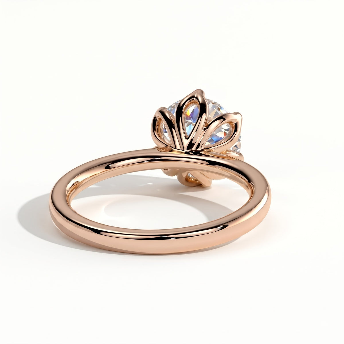 Round lab-grown diamond solitaire engagement ring in 18K (750) rose gold, on white background 