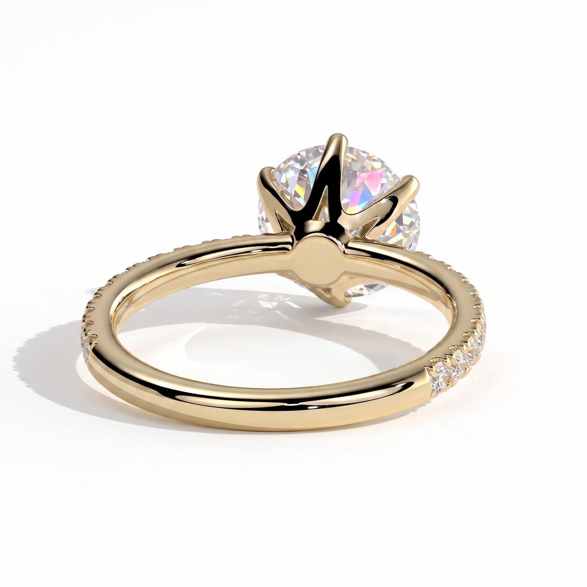 Round lab-grown diamond halo engagement ring in 14K (585) yellow gold, on white background 