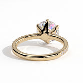 Round lab-grown diamond halo engagement ring in 18K (750) yellow gold, on white background 