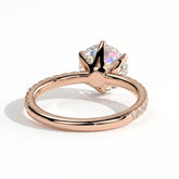 Round lab-grown diamond halo engagement ring in 18K (750) rose gold, on white background 