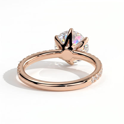 Round lab-grown diamond halo engagement ring in 18K (750) rose gold, on white background 