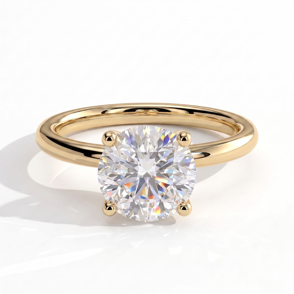 Round lab-grown diamond solitaire engagement ring in 14K (585) yellow gold, front view 