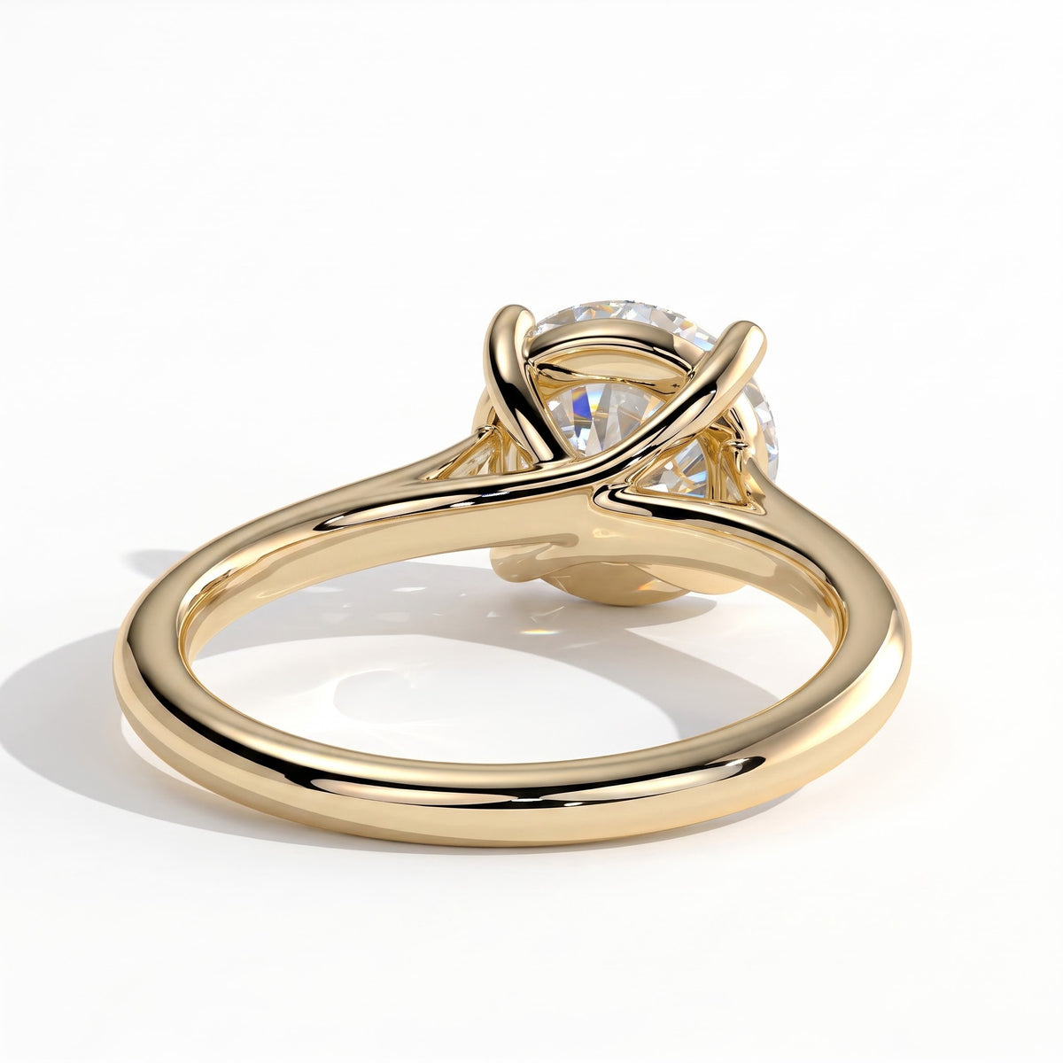Round lab-grown diamond solitaire engagement ring in 14K (585) yellow gold, on white background 