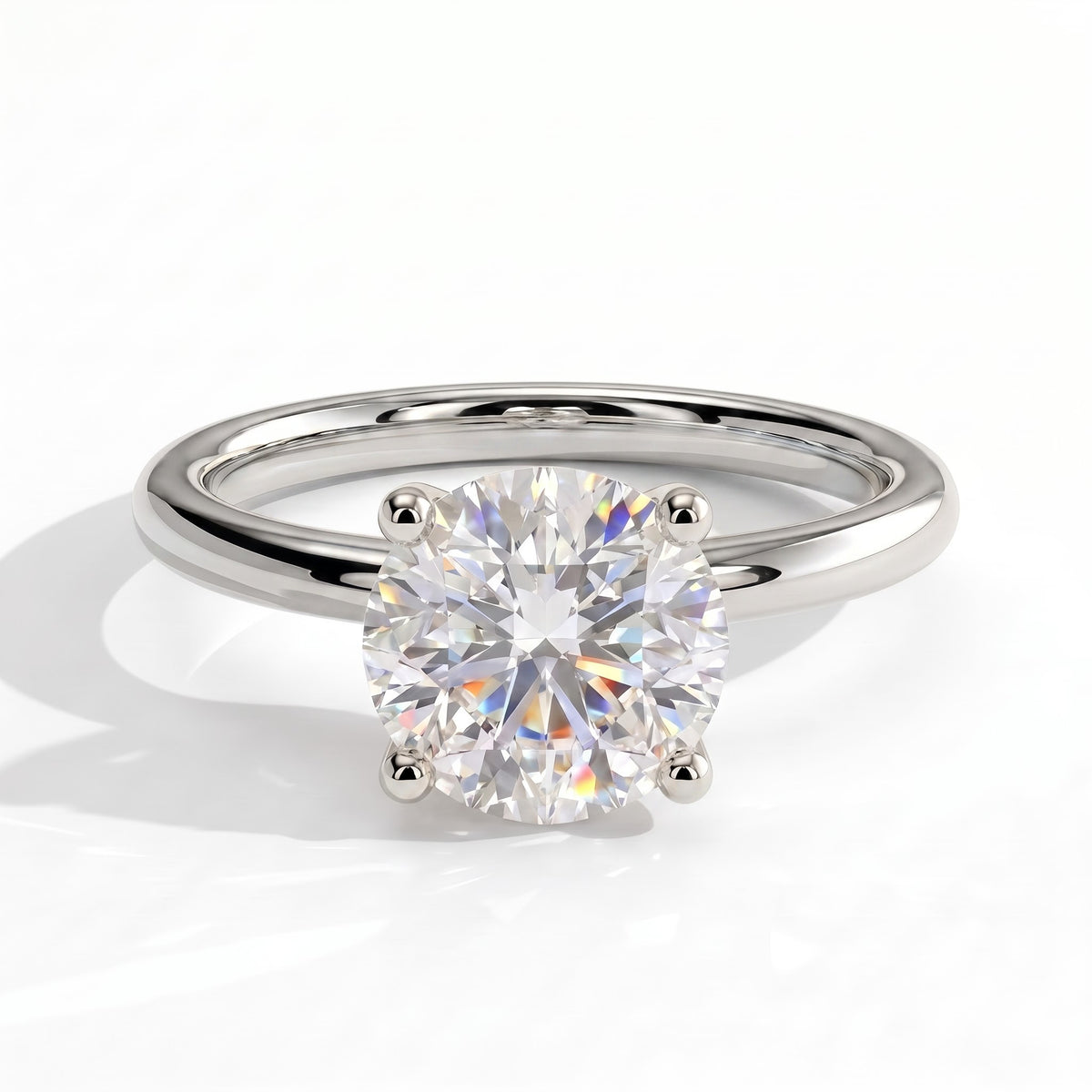 Round lab-grown diamond solitaire engagement ring in 950 platinum, front view 