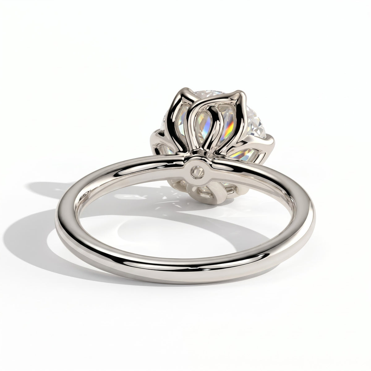 Round lab-grown diamond halo engagement ring in 14K (585) white gold, on white background 
