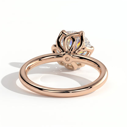 Round lab-grown diamond halo engagement ring in 18K (750) rose gold, on white background 