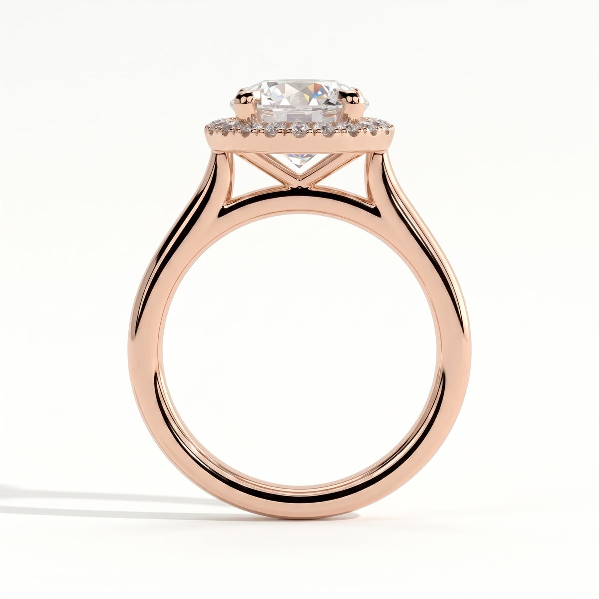Round lab-grown diamond halo engagement ring in 18K (750) rose gold, side profile 