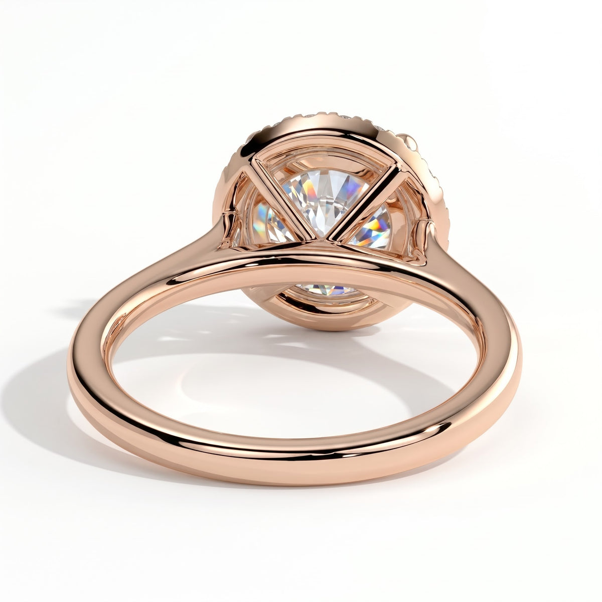 Round lab-grown diamond halo engagement ring in 14K (585) rose gold, on white background 
