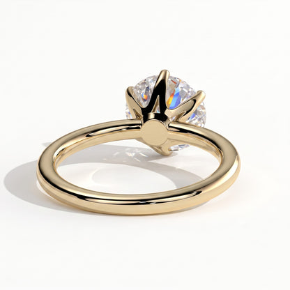 Round lab-grown diamond solitaire engagement ring in 14K (585) yellow gold, on white background 