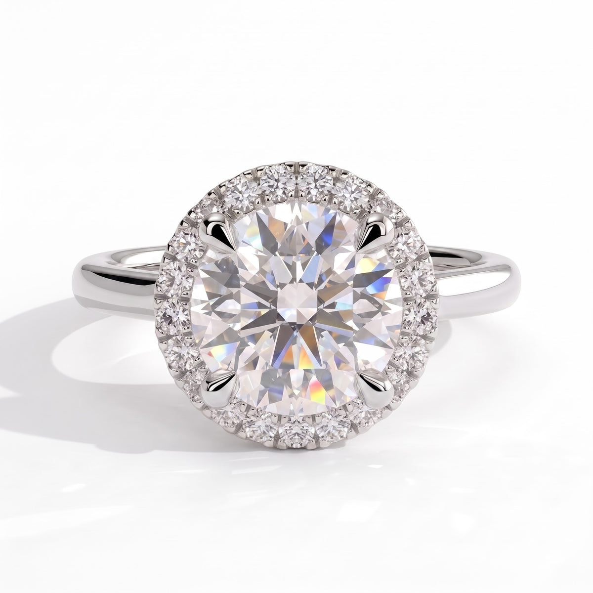 Round lab-grown diamond halo engagement ring in 950 platinum, front view 