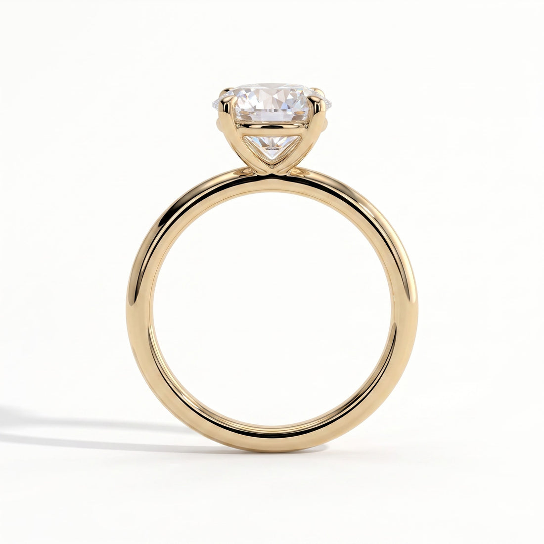 Round lab-grown diamond halo engagement ring in 14K (585) yellow gold, side profile 