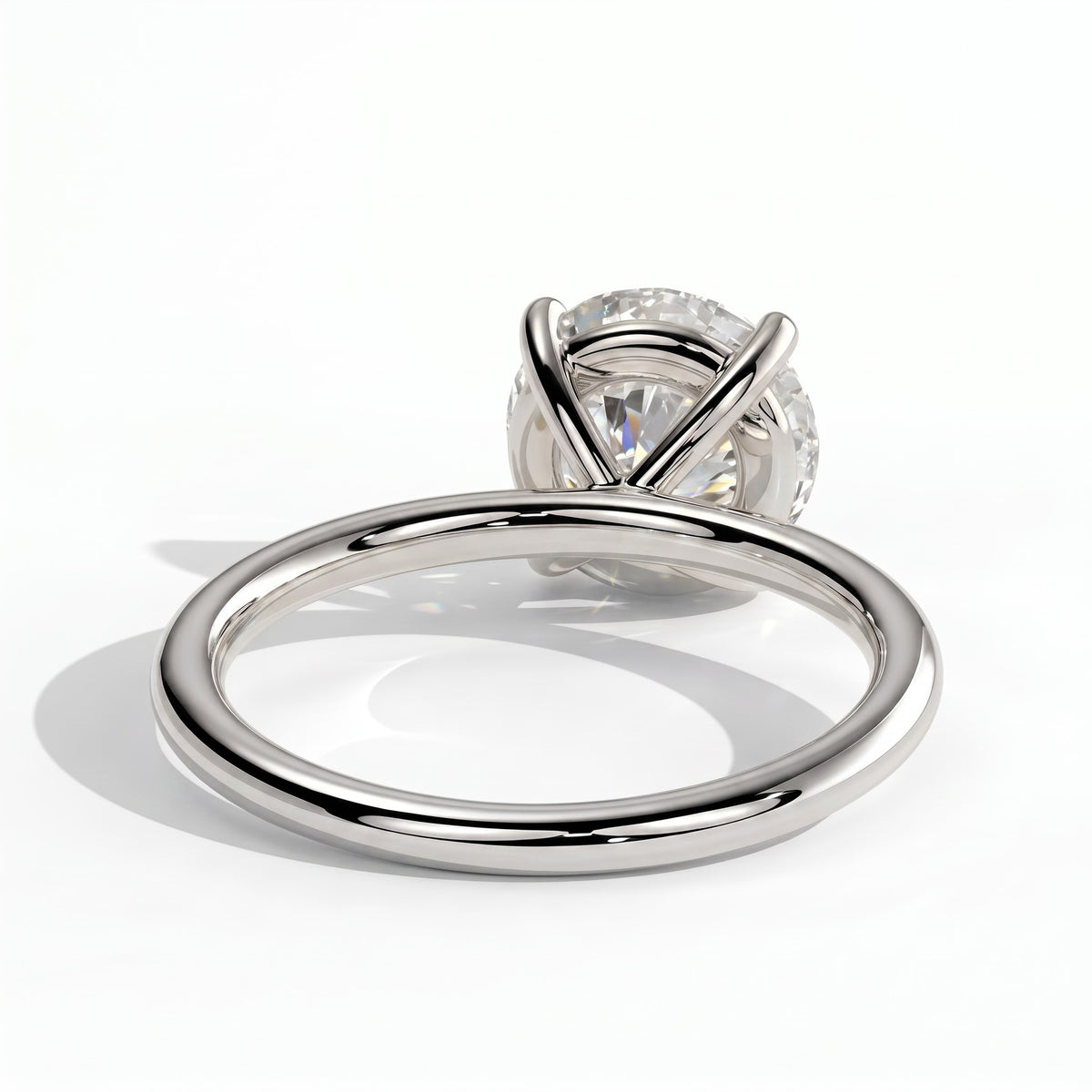 Round lab-grown diamond halo engagement ring in 18K (750) white gold, on white background 