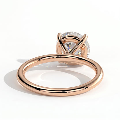 Round lab-grown diamond halo engagement ring in 18K (750) rose gold, on white background 