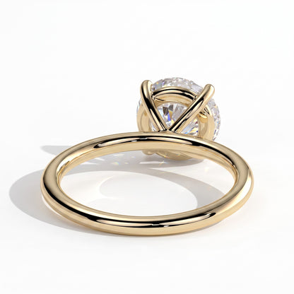 Round lab-grown diamond halo engagement ring in 18K (750) yellow gold, on white background 