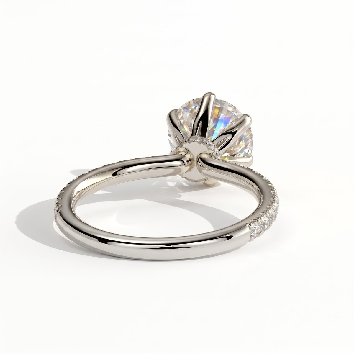 Round lab-grown diamond halo engagement ring in 14K (585) white gold, on white background 