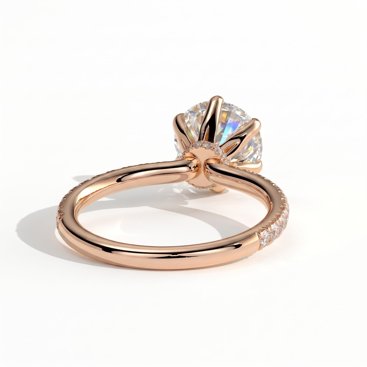 Round lab-grown diamond halo engagement ring in 14K (585) rose gold, on white background 