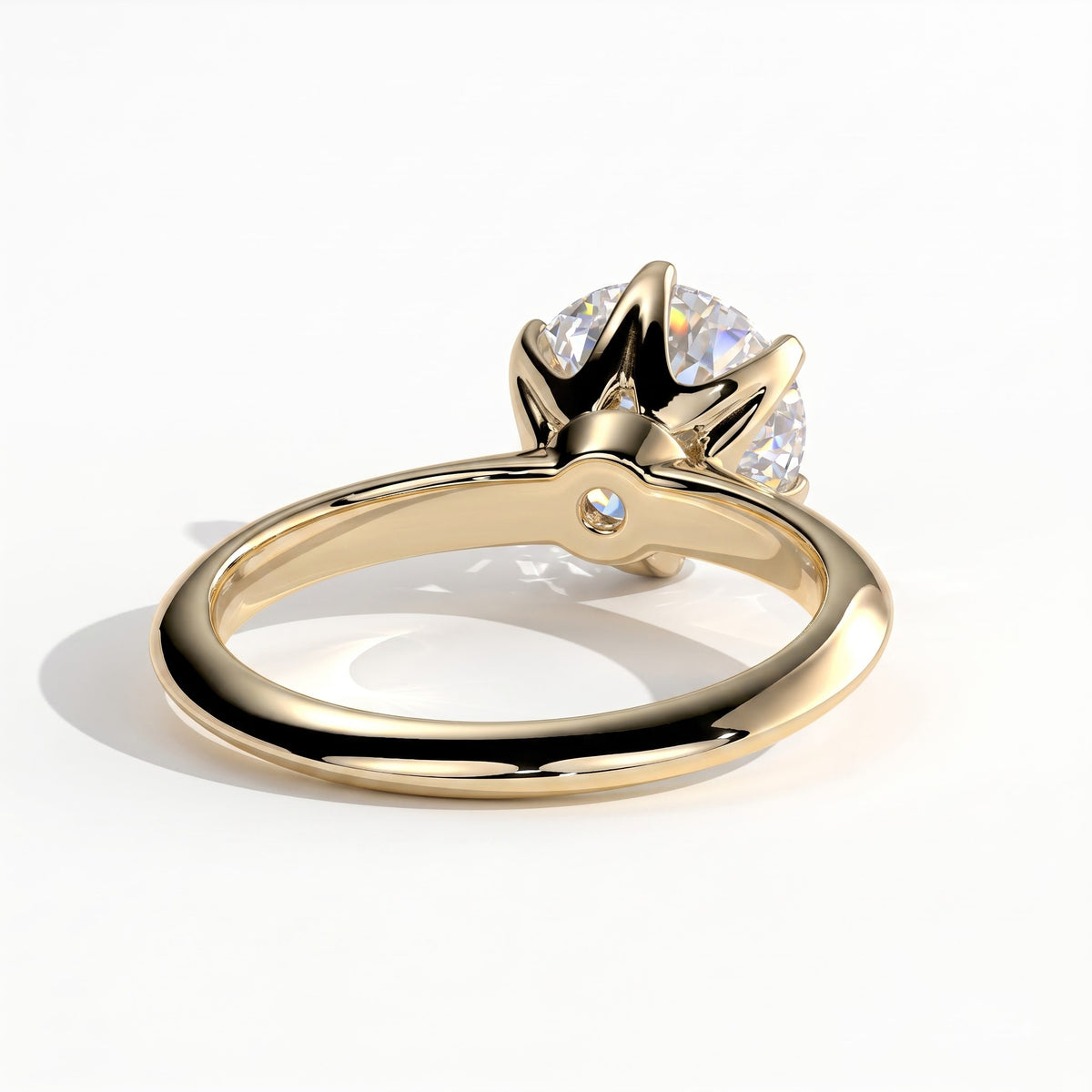 Round lab-grown diamond solitaire engagement ring in 14K (585) yellow gold, on white background 