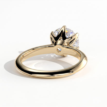 Round lab-grown diamond solitaire engagement ring in 14K (585) yellow gold, on white background 