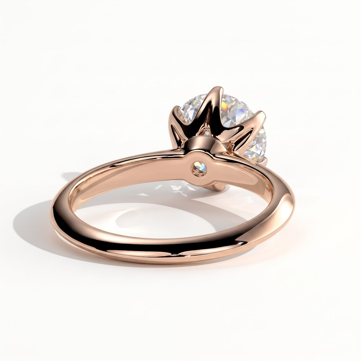Round lab-grown diamond solitaire engagement ring in 18K (750) rose gold, on white background 
