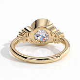 Round lab-grown diamond bezel-set halo engagement ring in 18K (750) yellow gold, on white background 